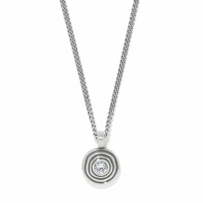 Brighton pendant necklace with silver-plated concentric circle design, central crystal, and curb chain on a white background