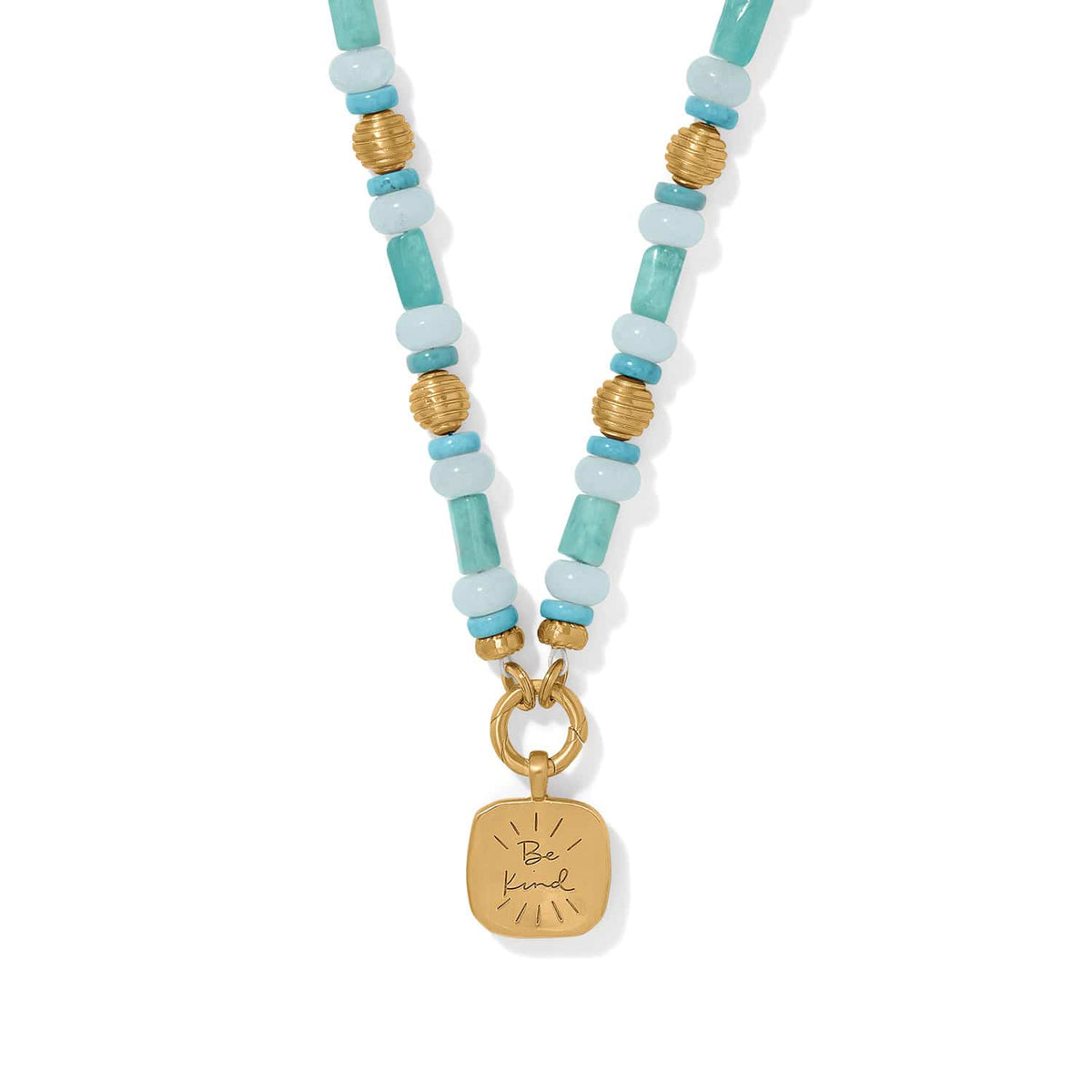 Brighton beaded pendant necklace with turquoise stones, gold-plated accents, and engraved Be Kind square charm on a white background