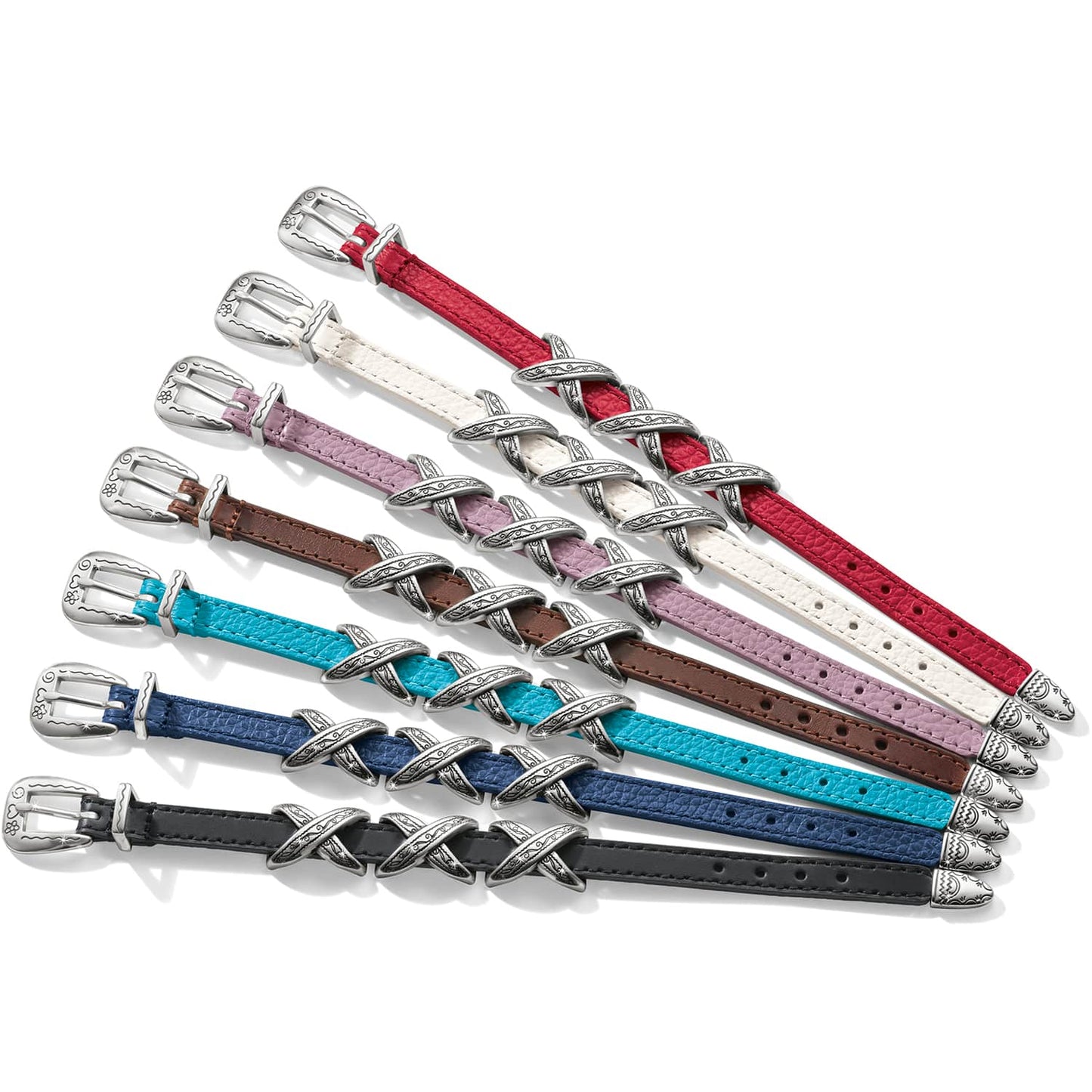 Brighton bracelets in seven colors with silver-plated buckles and crisscross accents arranged in fan formation on a white background