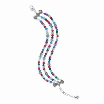 Brighton multi-strand beaded bracelet with colorful beads and silver-plated floral accents and lobster clasp on a white background