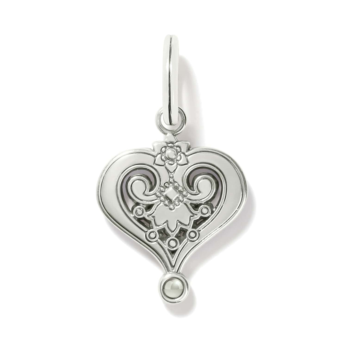 Brighton heart charm shown from the back with silver-plated scrollwork, floral detail, and small bead accent on a white background