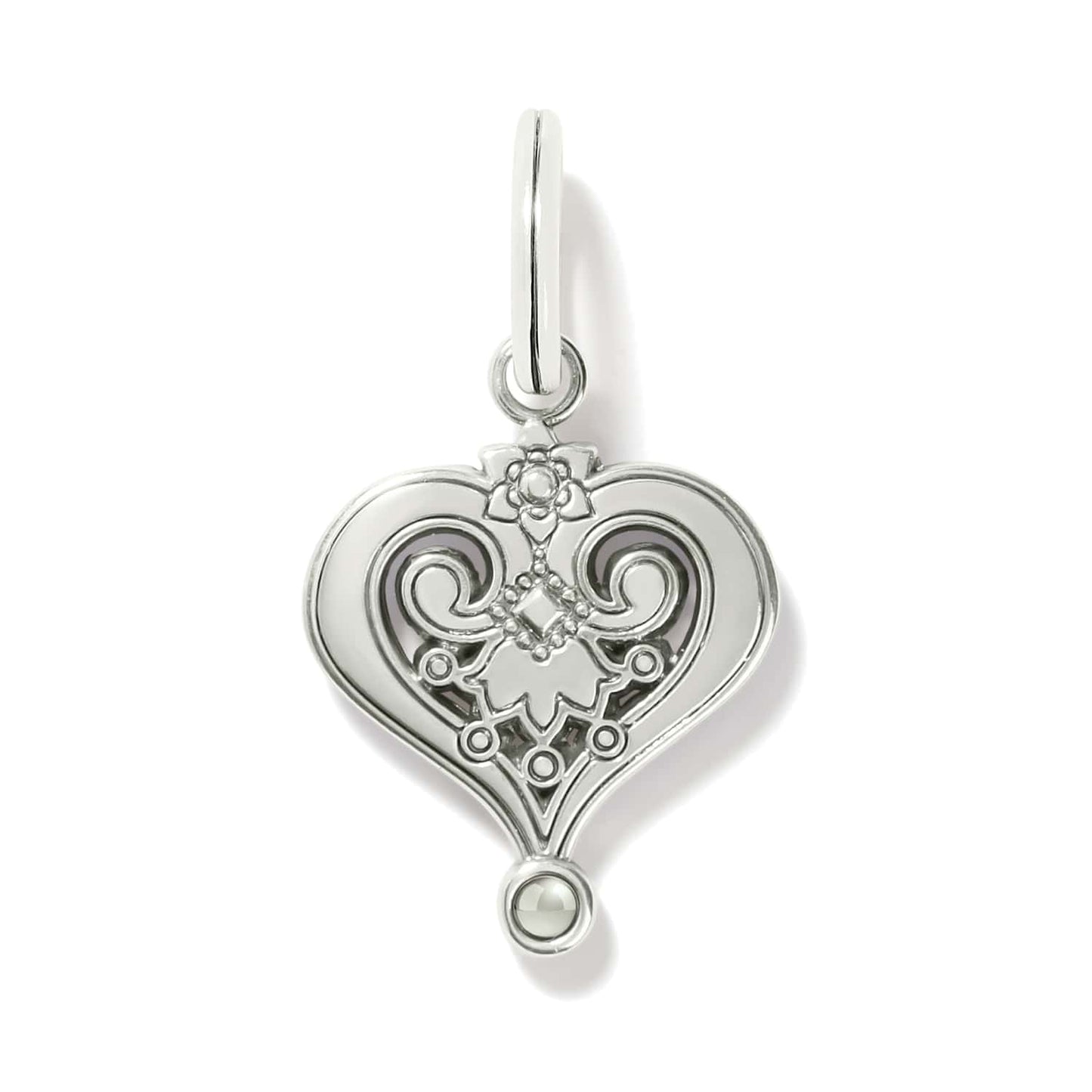 Brighton heart charm shown from the back with silver-plated scrollwork, floral detail, and small bead accent on a white background