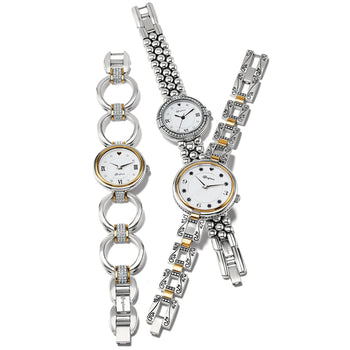 Brighton watches with silver-plated bracelets, gold accents, crystal detailing, and white dials with Roman numerals on a white background