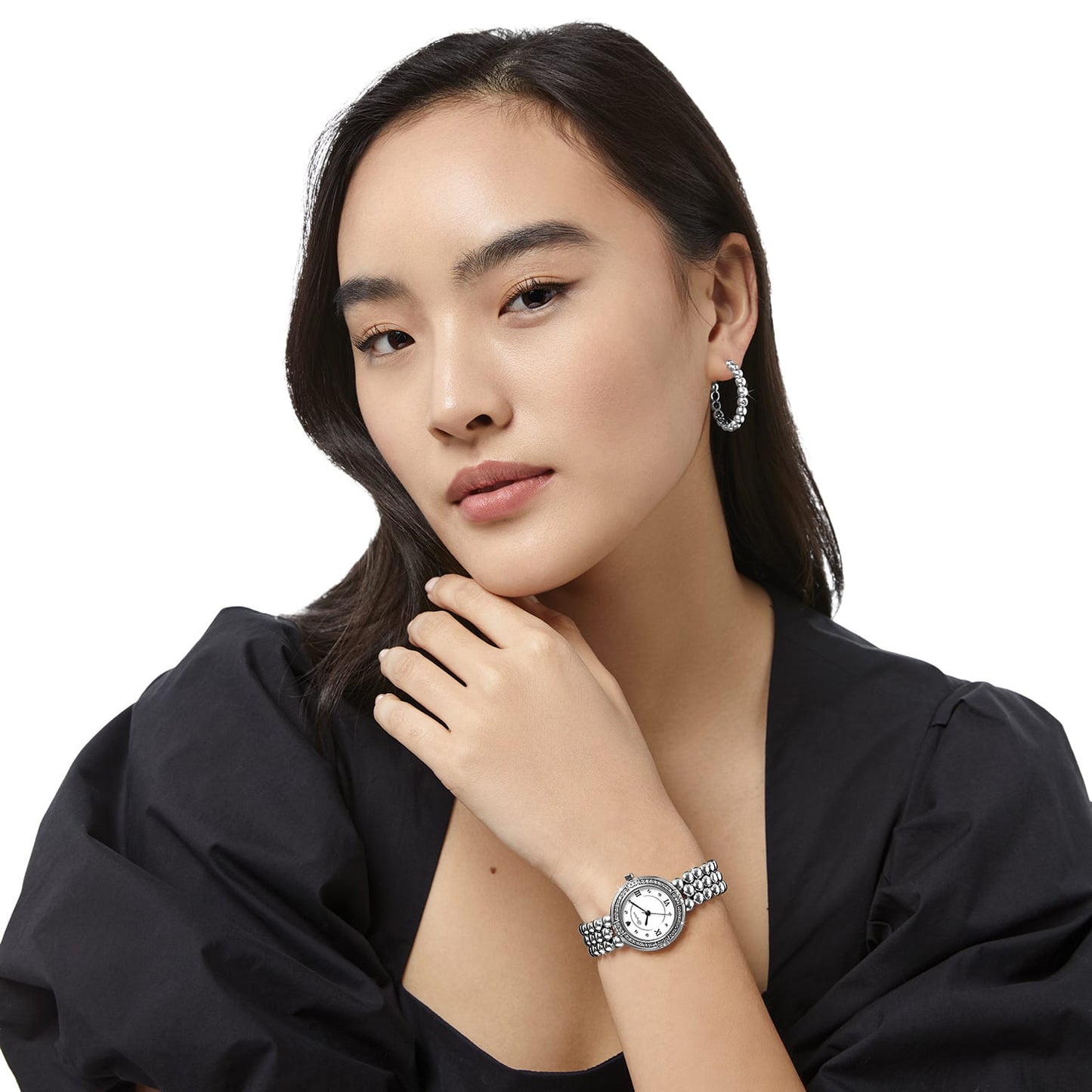 Model wearing a Brighton silver-plated watch with beaded bracelet band, crystal-accented bezel, and white dial
