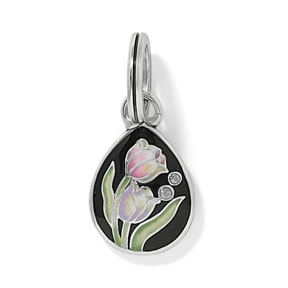 Brighton teardrop charm with silver-plated finish, black enamel, tulip design, and crystal accents on a white background