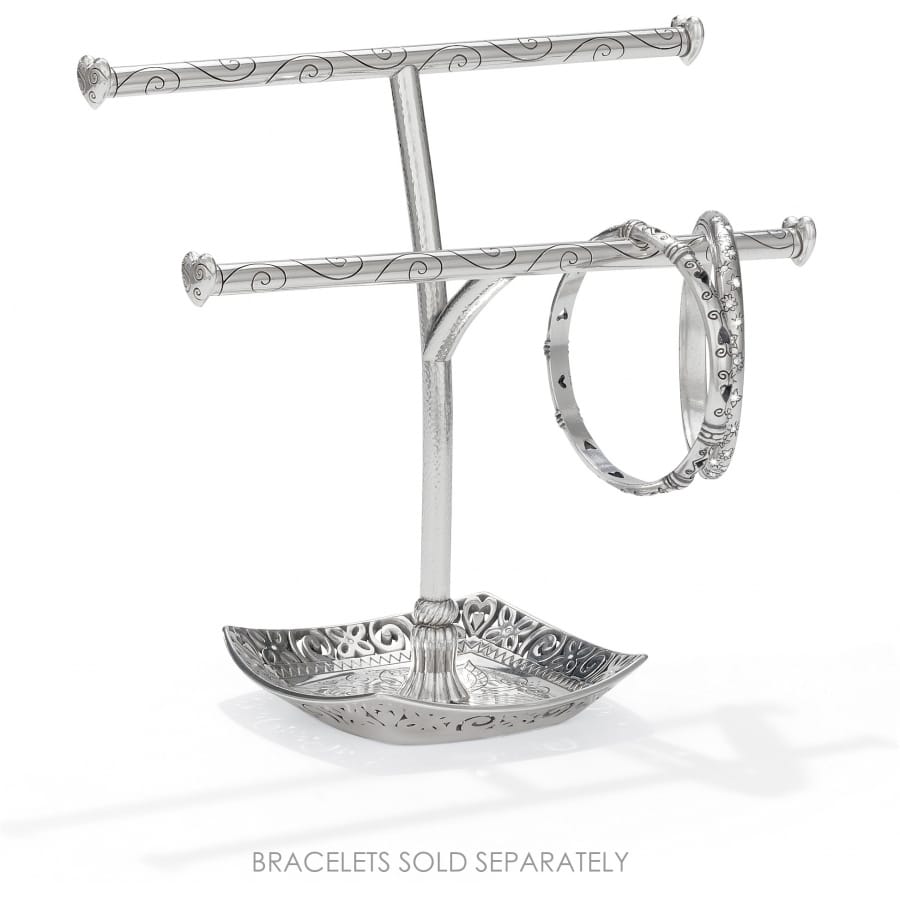Brighton silver-plated two-tier bracelet stand with scroll-engraved bars, decorative tray base, and one bangle on a white background