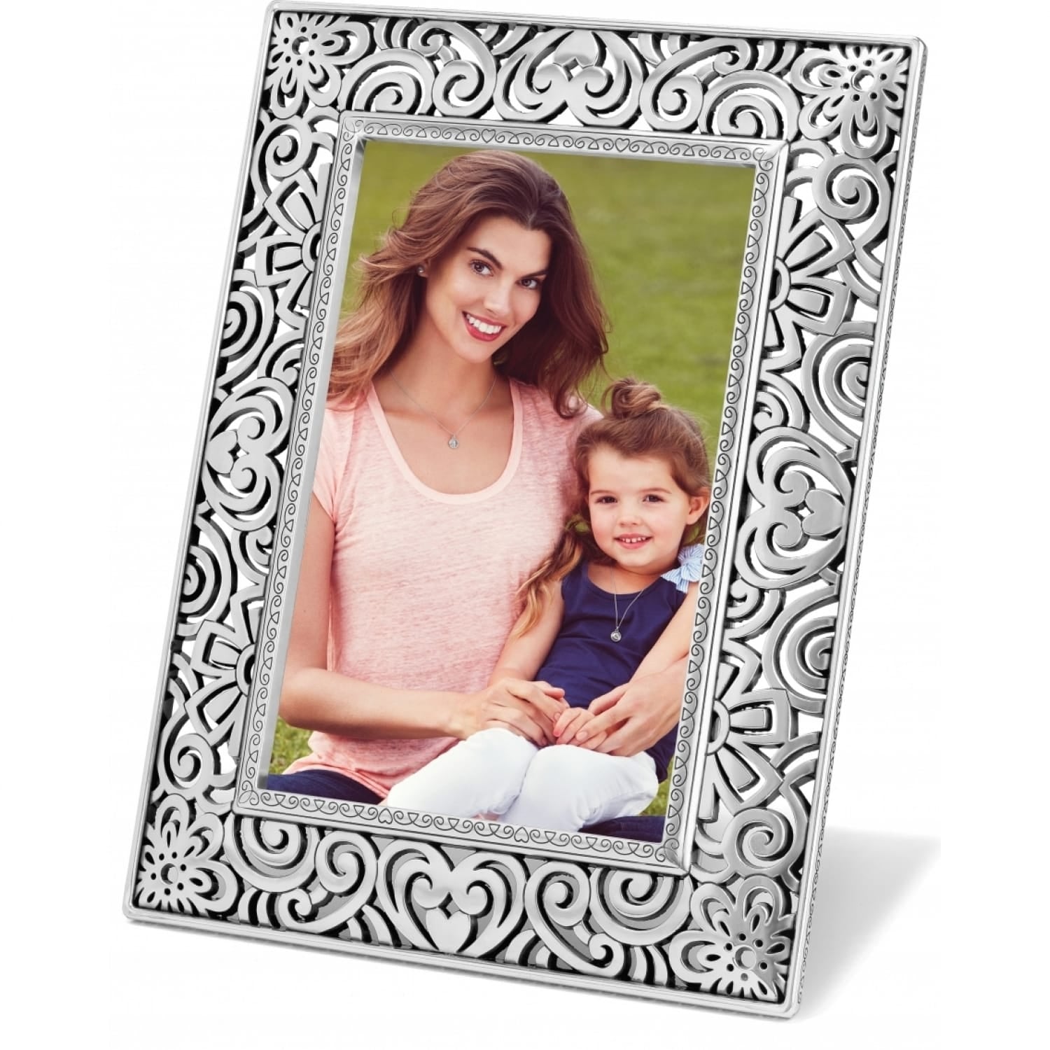 Brighton picture frame with silver-plated openwork scroll and floral design surrounding a family photo on a white background