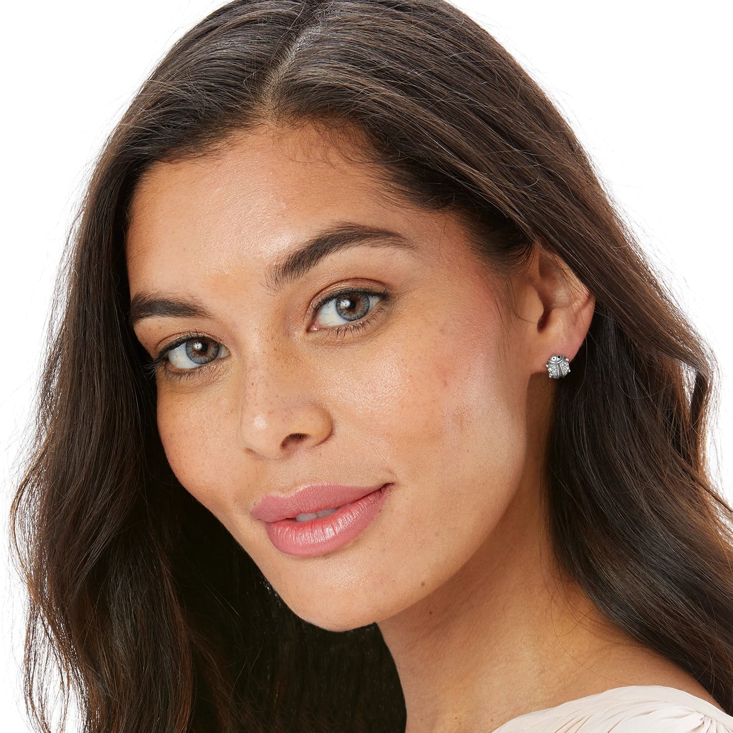 Model wearing Brighton silver-plated stud earrings with intricate detailed design and small crystal accents