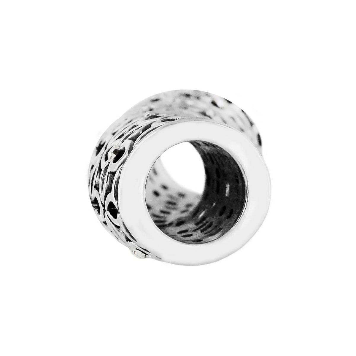 Brighton spacer charm shown from the side with silver-plated openwork scroll pattern on a white background