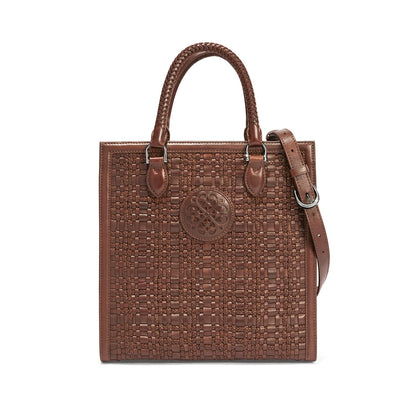 Brighton woven leather tote handbag in brown with braided handles, medallion emblem, and adjustable shoulder strap on a white background