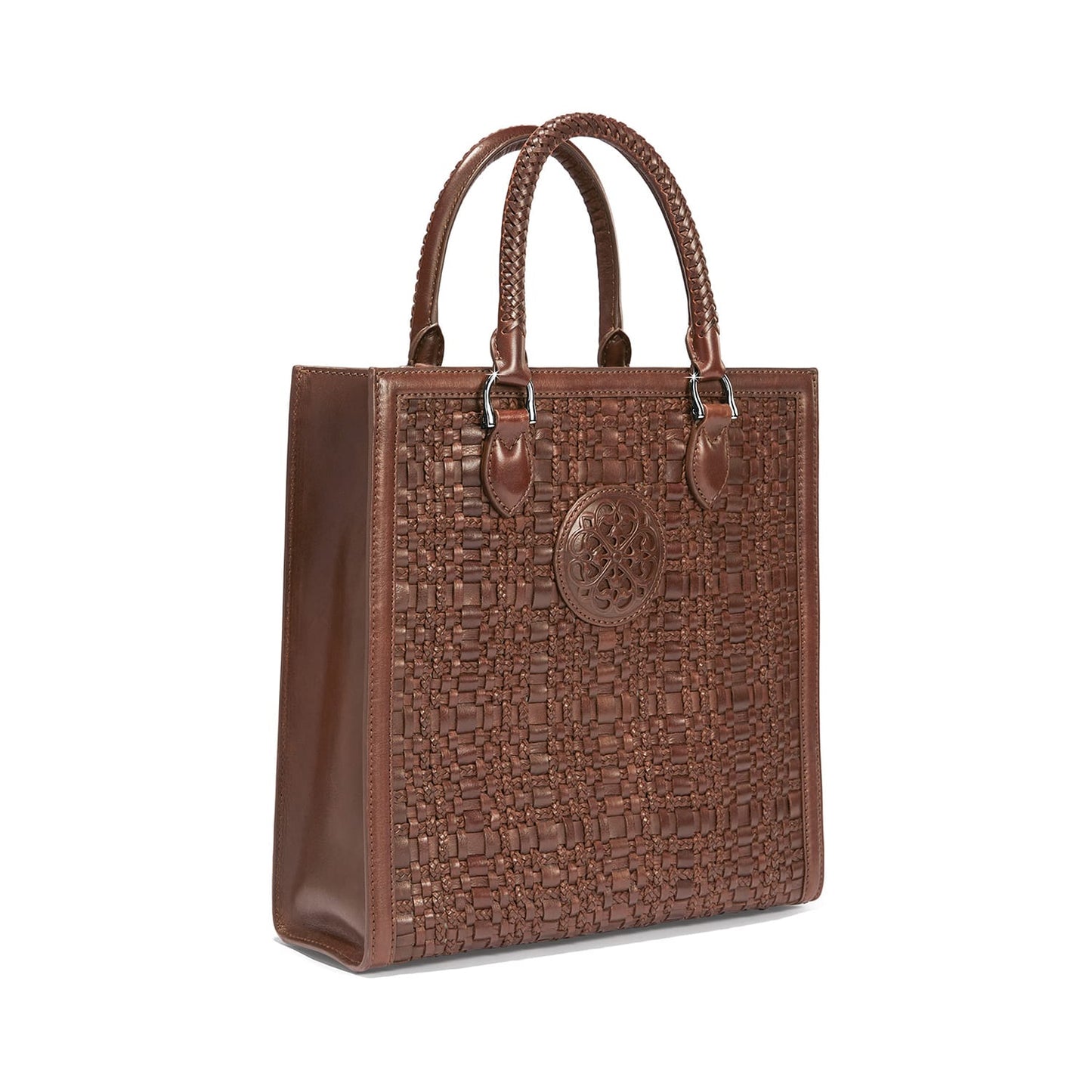 Brighton tote handbag in brown woven leather with braided handles and embossed medallion on a white background