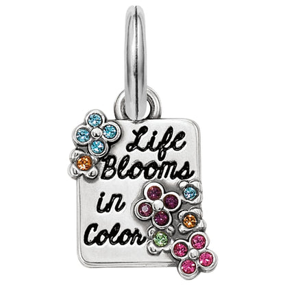Brighton charm with Life Blooms in Color script, silver-plated flowers, and multicolor crystal accents on a white background