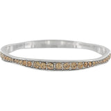 Brighton silver-plated bangle bracelet with row of orange fine quality crystals and beaded detailing on a white background