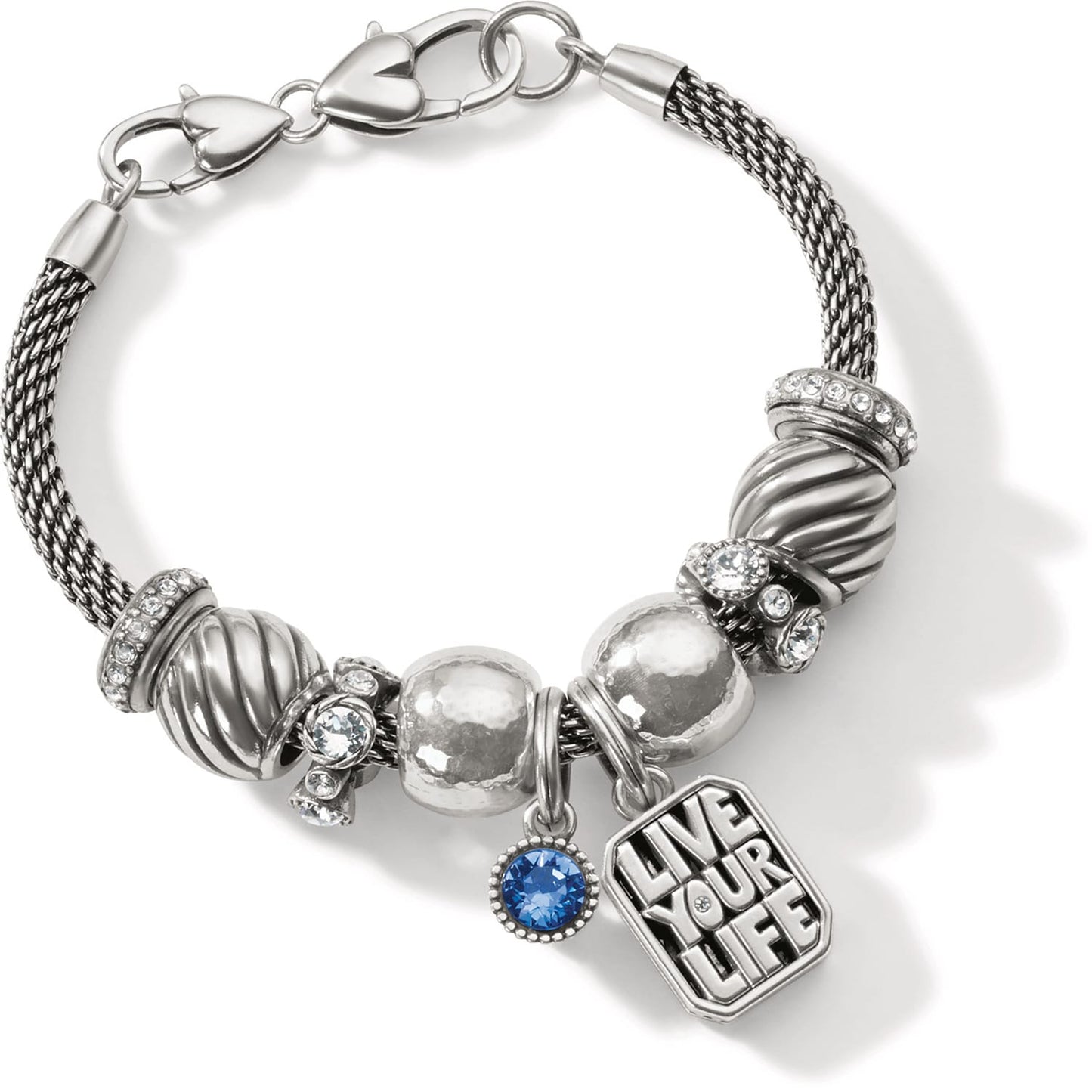 Brighton charm bracelet with silver-plated beads, crystal accents, blue stone, and Live Your Life tag on a white background