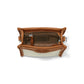 Brighton tan leather handbag interior view showing zippered pocket, suede lining, and silver-tone hardware on a white background