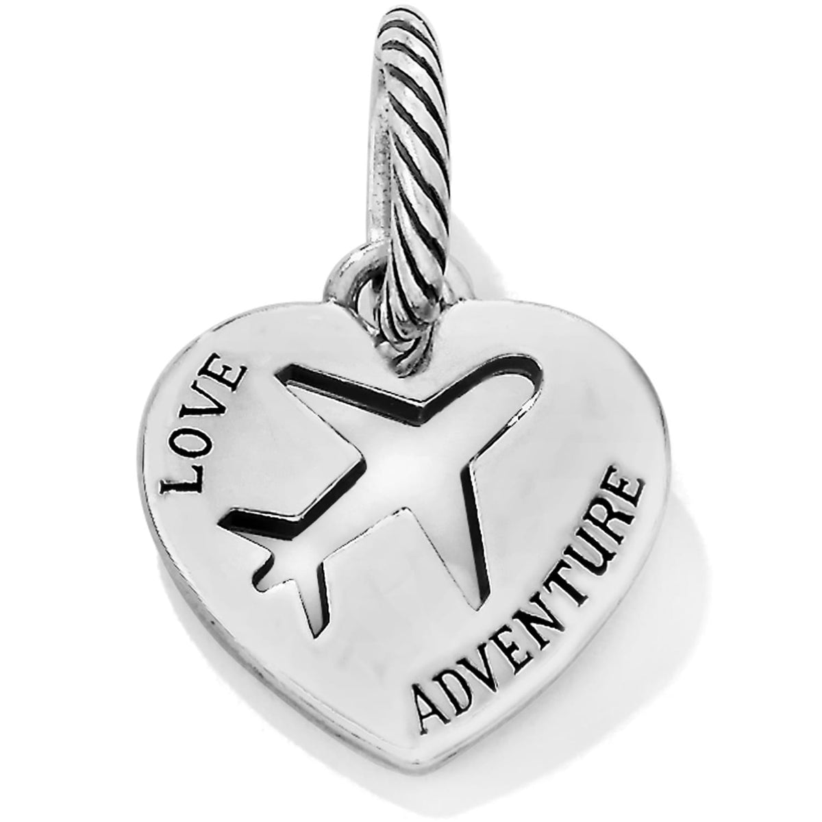 Brighton heart charm with silver-plated finish, airplane cutout, and engraved Love Adventure text on a white background
