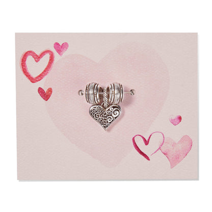 Brighton silver-plated heart charm with scrollwork detail and ribbed spacer beads on a pink heart-printed card
