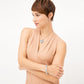 Model wearing a Brighton silver-plated heart pendant necklace with coordinating Brighton earrings and hinged bangle bracelet