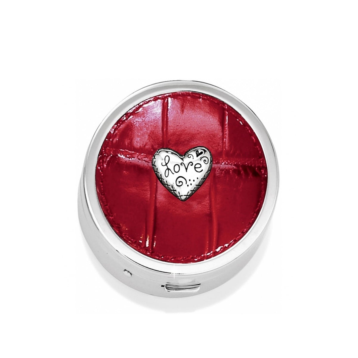 Brighton round pill box with red croc-embossed lid and silver-tone heart love medallion on a white background