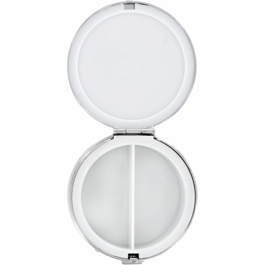 Brighton pill case shown open with round white two-compartment interior and hinged mirrored lid on a white background