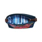 Brighton denim handbag shown open with blue striped interior lining, floral embroidery, and brown leather straps on a white background