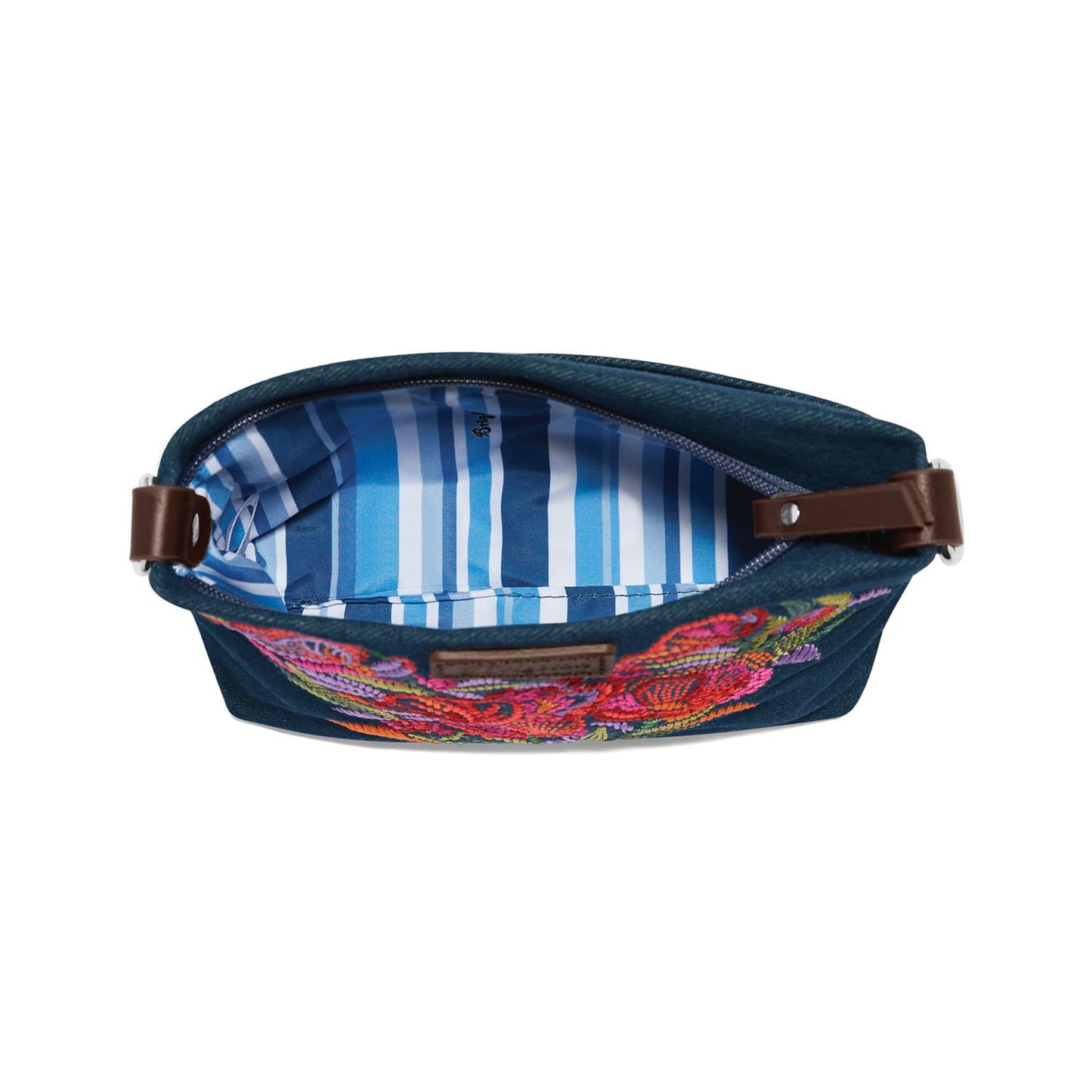 Brighton denim handbag shown open with blue striped interior lining, floral embroidery, and brown leather straps on a white background