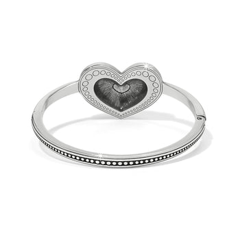 Brighton silver-plated bangle bracelet with heart medallion featuring enamel center and beaded detailing on a white background