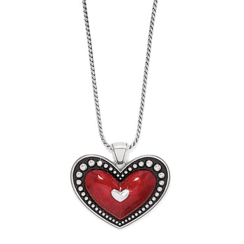Brighton heart pendant necklace with red enamel center, silver-plated beaded border, and rope chain on a white background