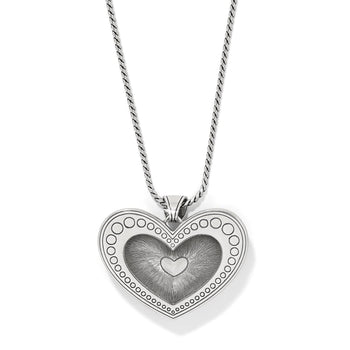 Brighton heart pendant necklace with silver-plated dotted border and engraved center heart detail on a white background