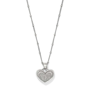Brighton heart pendant necklace with silver-plated beaded chain and textured heart medallion on a white background