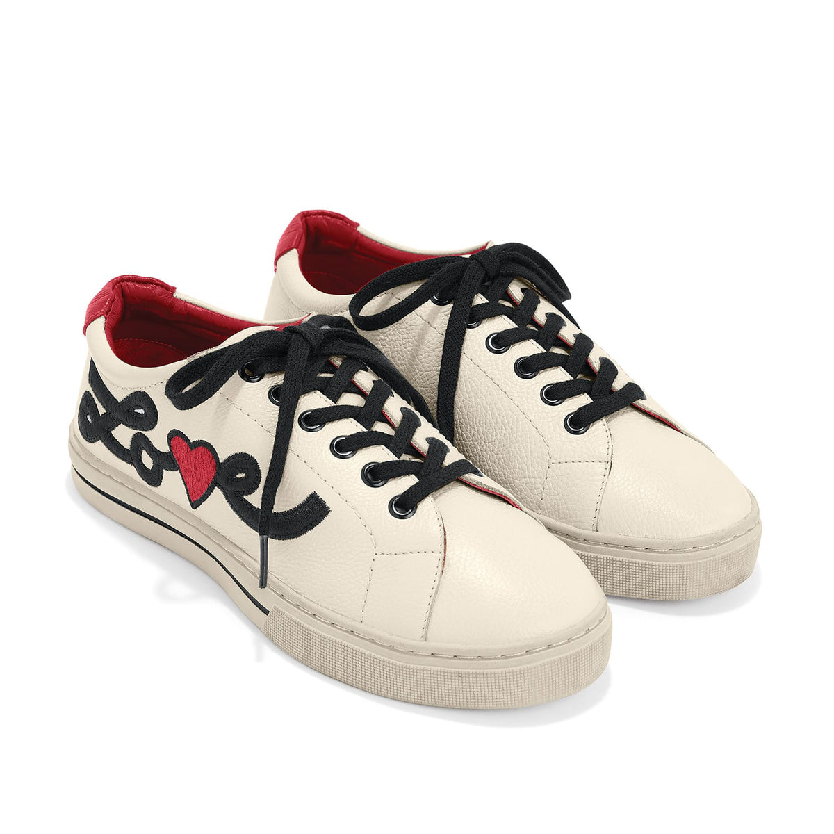 Brighton cream leather sneakers with black laces, red heel tabs, and embroidered love script with heart on a white background