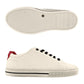 Brighton white leather sneakers with black laces, red heel accent, and patterned rubber sole on a white background