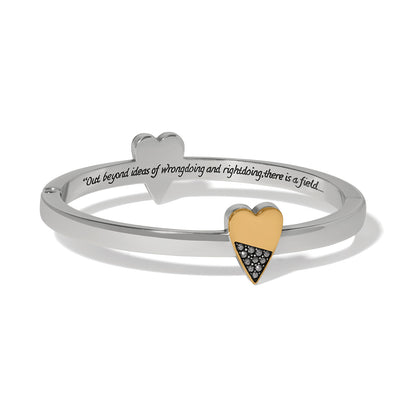 Brighton hinged bangle bracelet with gold two-tone heart, crystal accents, and engraved inscription on a white background