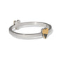 Brighton two-tone hinged bangle bracelet with gold heart accents and crystal pavé detail on a white background
