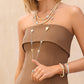 Model wearing a Brighton two-tone heart station necklace with crystals and coordinating Brighton accessories