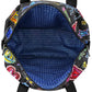Close-up of Brighton handbag interior view showing blue patterned lining with chevron print and zippered pocket