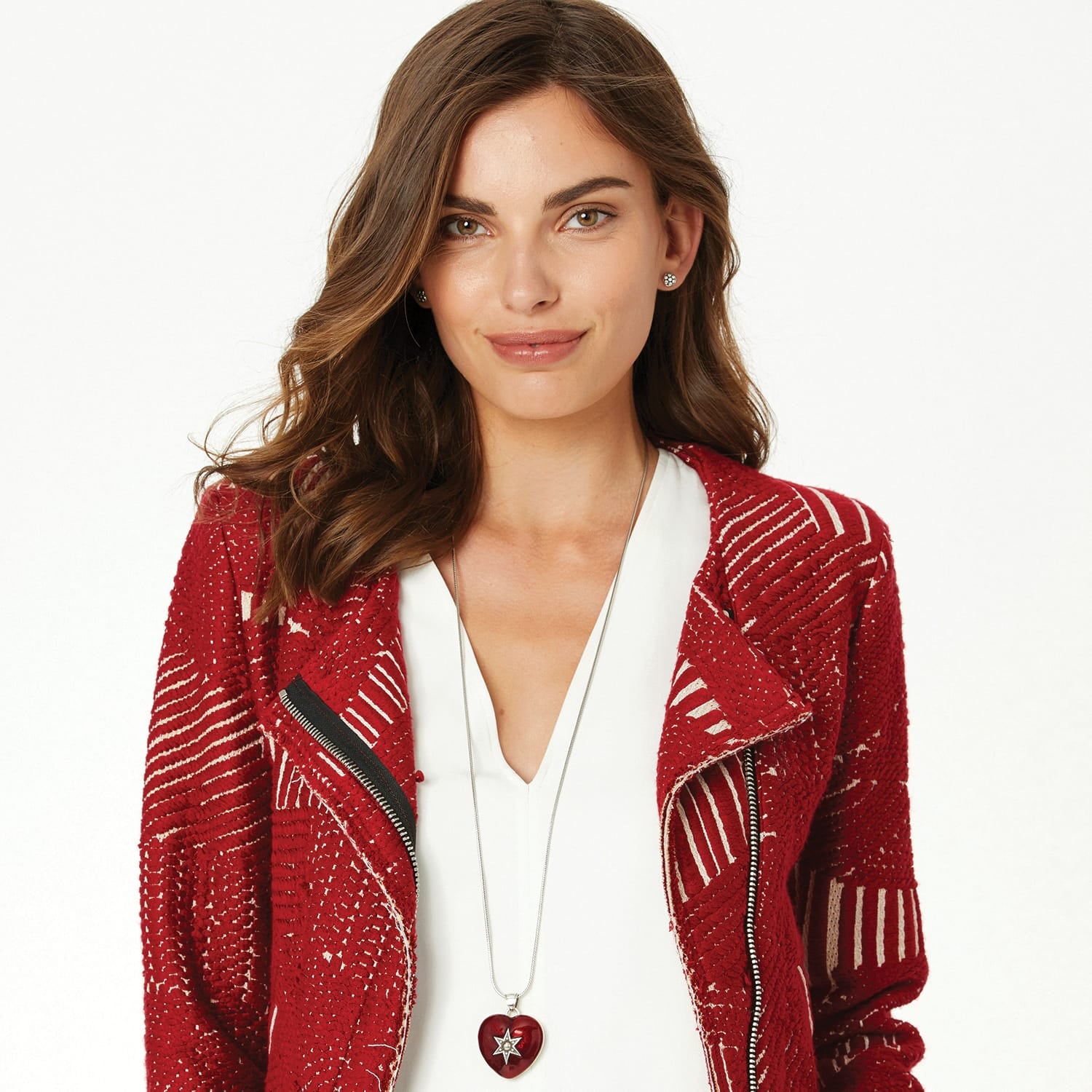 Model wearing a Brighton long silver-plated pendant necklace with red heart charm and crystal star accent