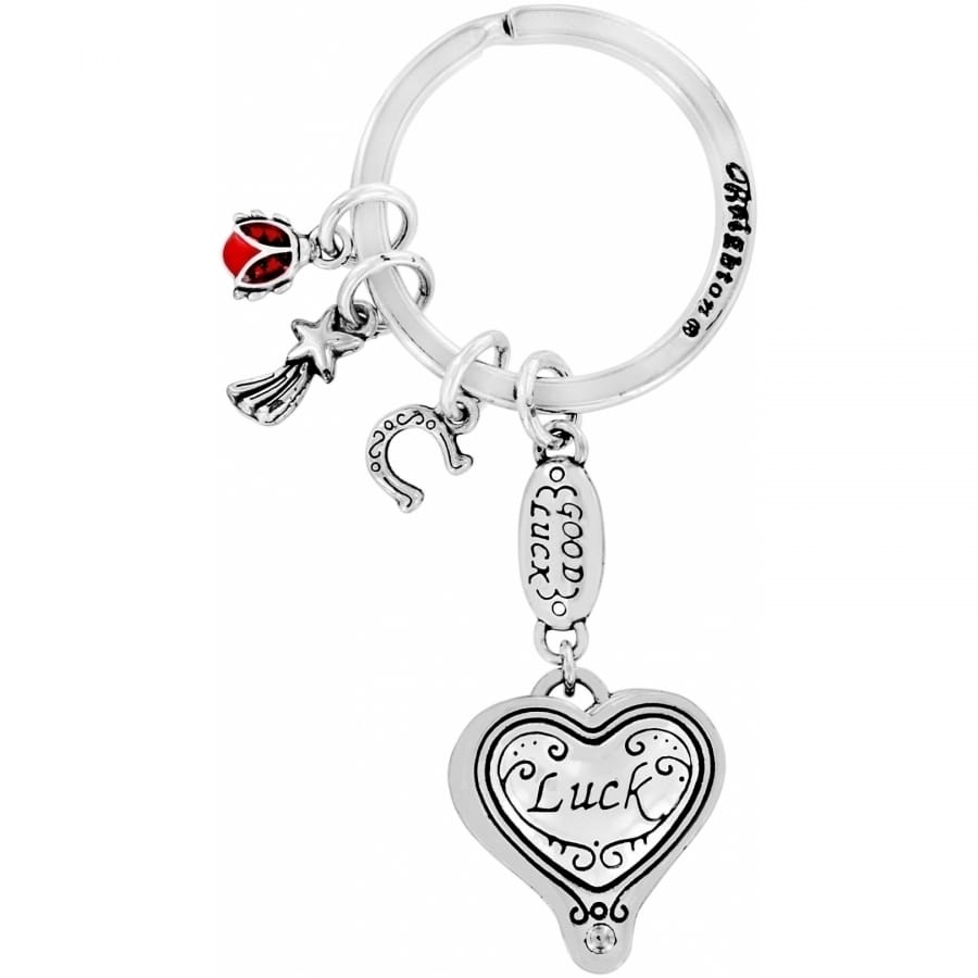 Brighton keychain with silver-plated luck heart charm, good luck tag, horseshoe, and red ladybug on white background
