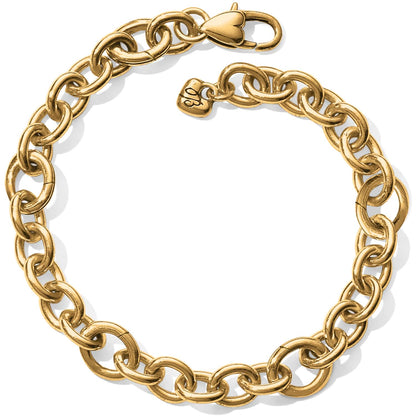 Brighton chain link bracelet with gold-tone oval links, lobster clasp, and small heart charm on a white background
