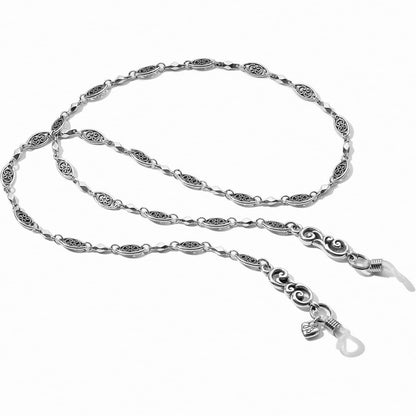 Brighton eyeglass chain with silver-plated oval filigree links and decorative scroll end pieces on a white background