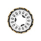 Brighton charm with silver-tone center, engraved oval detailing, and gold-tone braided outer ring on a white background
