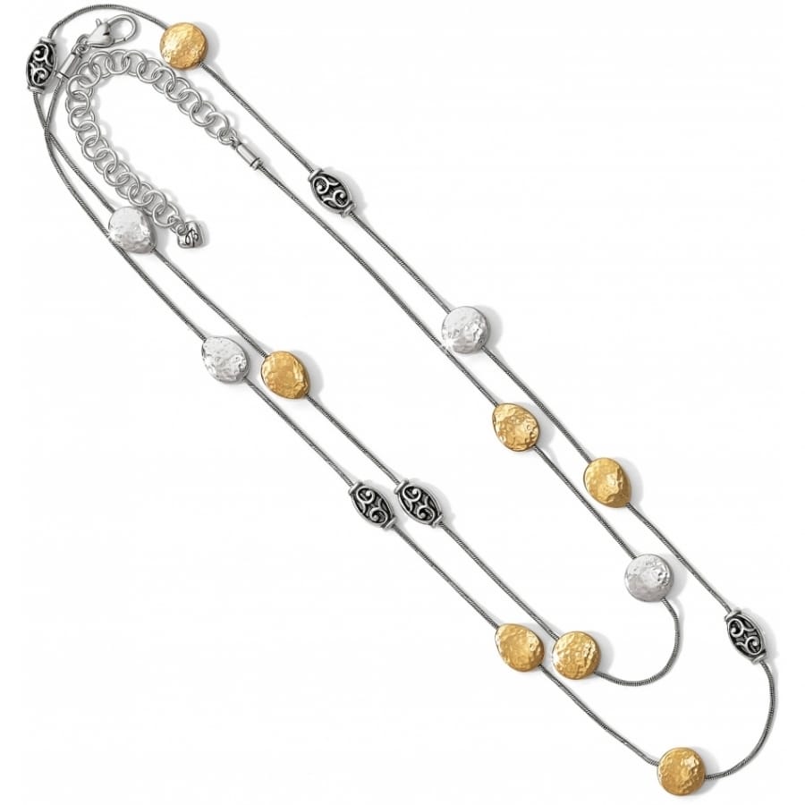 Brighton layered necklace with hammered silver-plated and brushed gold discs and scroll station beads on a white background