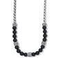 Brighton necklace with black onyx beads, silver-plated rope chain, and crystal pavé station accents on a white background