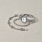 Brighton silver-plated watch with crystal-accented bezel styled with beaded bracelets featuring crystal stations on neutral background