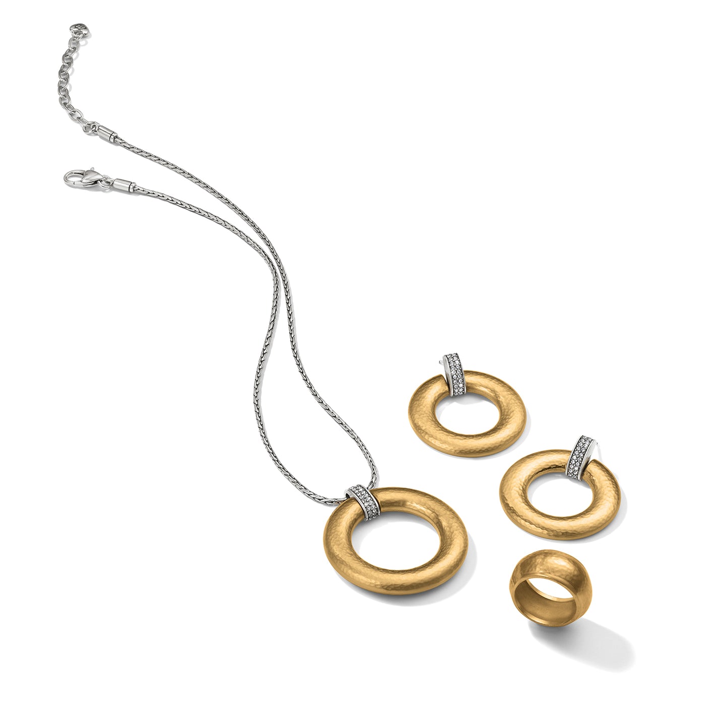 Brighton two-tone jewelry set styled with hammered gold rings, crystal accents, and silver chain necklace on white background