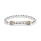 Brighton beaded stretch bracelet with Grateful bar, crystal pave accents, and two-tone finish on a white background