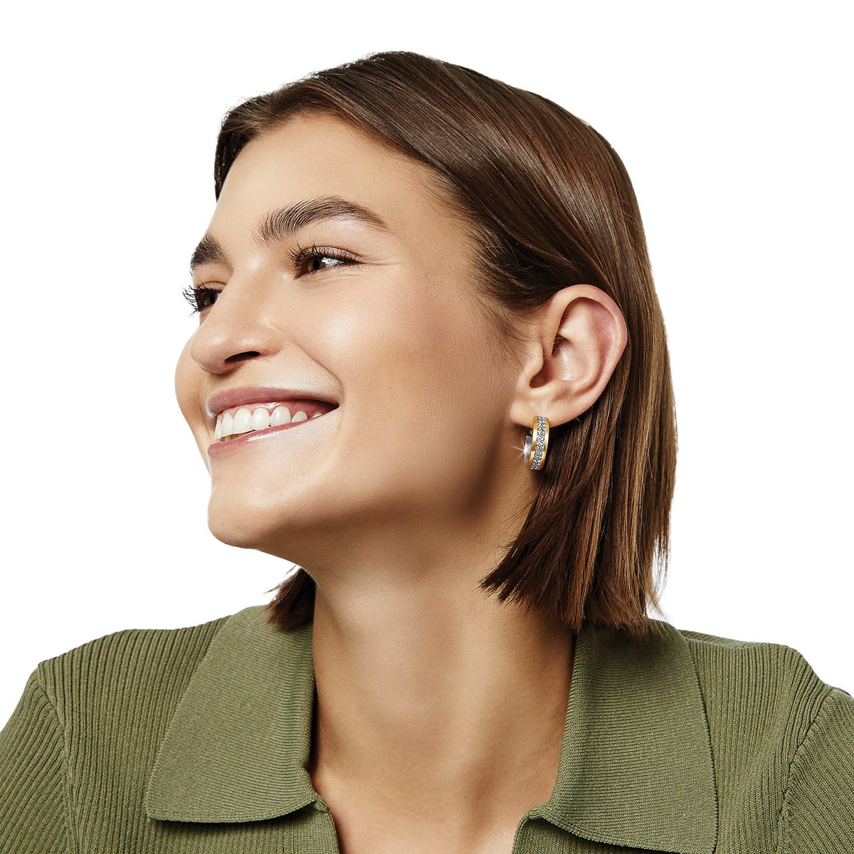 Model wearing a Brighton two-tone hoop earring with pavé crystal accents and polished gold-tone edges