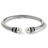 Brighton silver-plated hinged cuff bracelet with pearl end caps, crystal pavé, and black lacquer accents on a white background