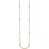 Brighton long gold-plated chain necklace with eight crystal pavé barrel stations spaced along the strand on a white background