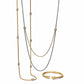 Brighton gold-plated and silver-plated layered chain necklaces with crystal bead stations and matching gold cuff bracelet on white background